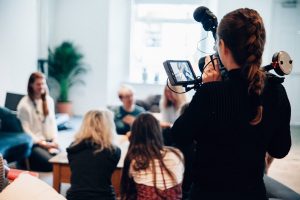 videographer-filming-discussion