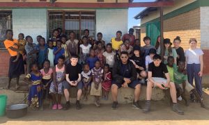 Accrington Academy pupils pictured with local children in Malawi